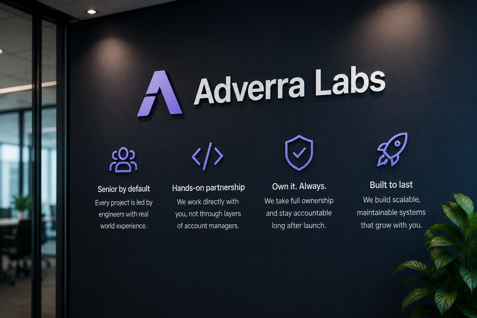 The Adverra Labs office, with the team's values — senior by default, hands-on partnership, full ownership, and built to last — on the wall